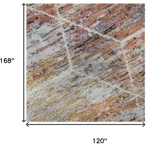 Photo of Pink Peach And Ivory Geometric Washable Area Rug With UV Protection