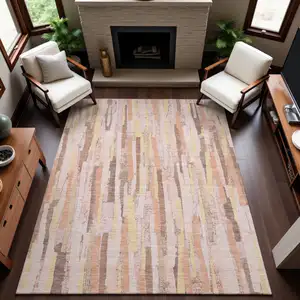 Photo of Pink Yellow And Peach Striped Washable Area Rug With UV Protection