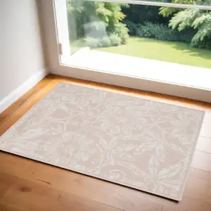 Photo of Pink and Ivory Floral Distressed Area Rug