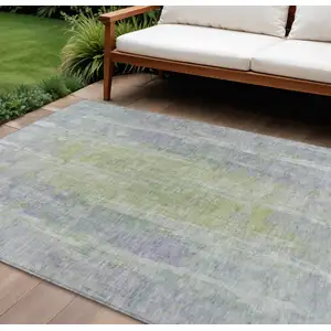Photo of Plum And Green Abstract Washable Indoor Outdoor Area Rug