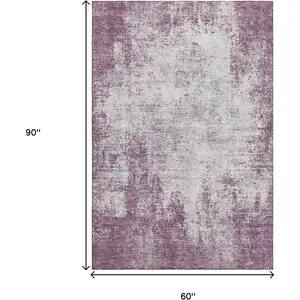 Photo of Plum And Ivory Abstract Washable Area Rug With UV Protection
