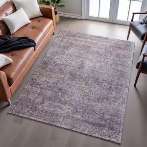 Photo of Plum And Ivory Abstract Washable Area Rug With UV Protection