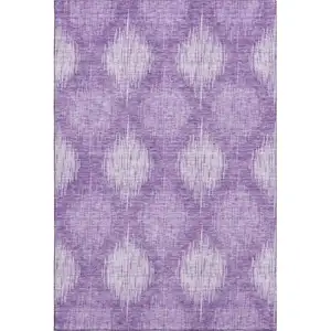 Photo of Plum And Ivory Ikat Washable Area Rug With UV Protection