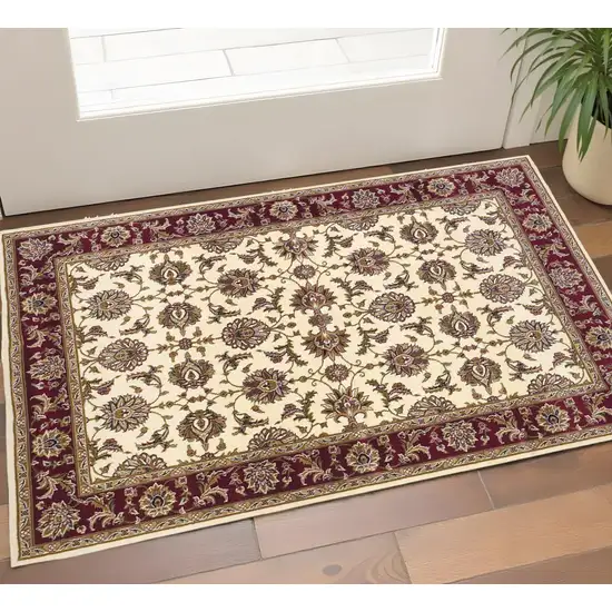 Red Ivory And Brown Floral Medallion Area Rug Photo 1
