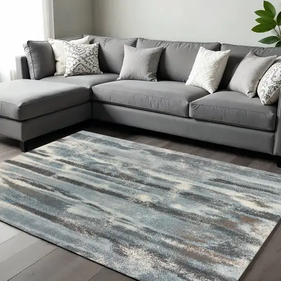 Teal Blue And White Abstract Distressed Area Rug Photo 1
