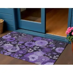 Photo of Purple And Black Floral Washable Indoor Outdoor Area Rug