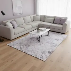 Photo of Purple And Ivory Abstract Geometric Washable Area Rug With UV Protection