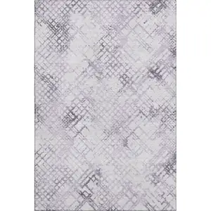 Photo of Purple And Ivory Abstract Geometric Washable Area Rug With UV Protection