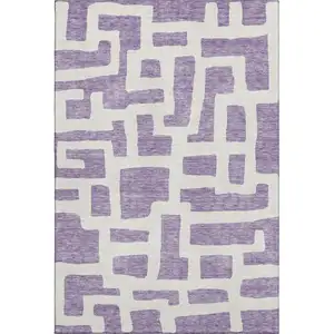Photo of Purple And Ivory Abstract Geometric Washable Area Rug With UV Protection