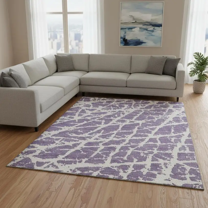 Purple And Ivory Abstract Washable Area Rug With UV Protection Photo 1