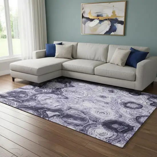 Purple And Ivory Abstract Washable Area Rug With UV Protection Photo 1