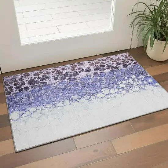 Purple And Ivory Abstract Washable Area Rug With UV Protection Photo 1