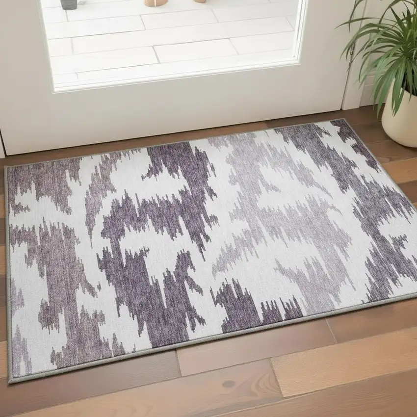 Purple And Ivory Abstract Washable Area Rug With UV Protection Photo 2