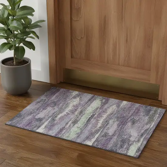 Purple And Ivory Abstract Washable Area Rug With UV Protection Photo 1