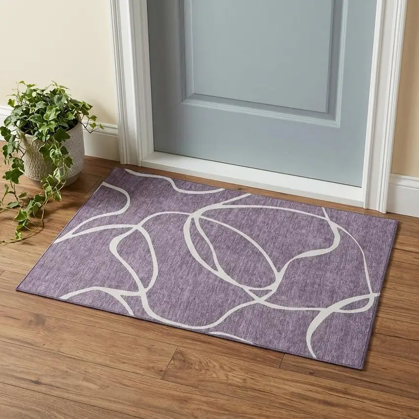 Purple And Ivory Abstract Washable Area Rug With UV Protection Photo 1