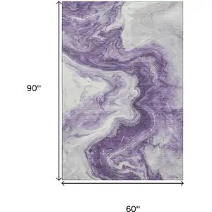 Photo of Purple And Ivory Abstract Washable Area Rug With UV Protection