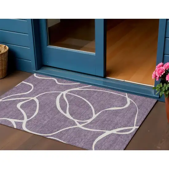 Purple And Ivory Abstract Washable Indoor Outdoor Area Rug Photo 1