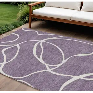 Photo of Purple And Ivory Abstract Washable Indoor Outdoor Area Rug