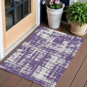 Photo of Purple And Ivory Abstract Washable Indoor Outdoor Area Rug