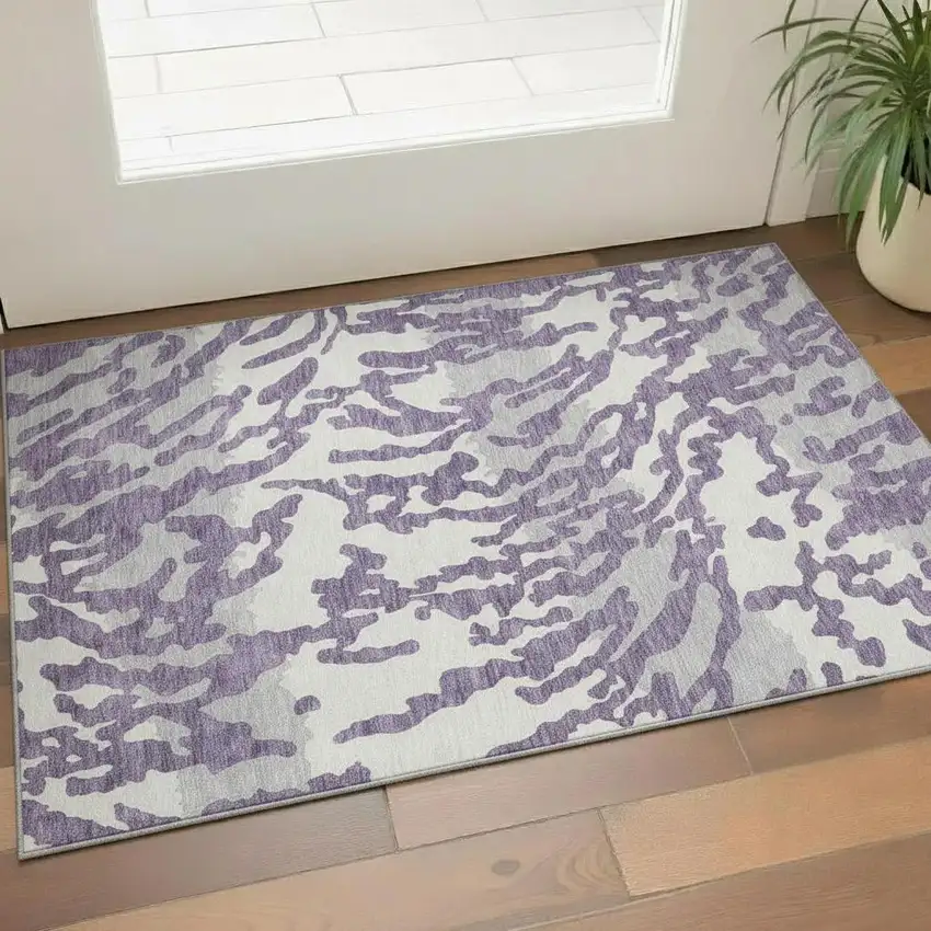 Purple And Ivory Animal Print Washable Area Rug With UV Protection Photo 1