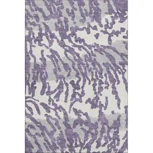 Photo of Purple And Ivory Animal Print Washable Area Rug With UV Protection