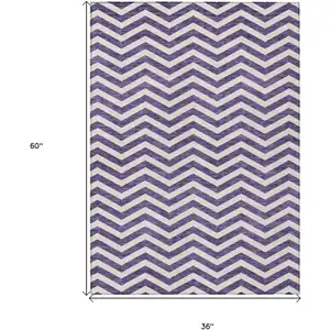 Photo of Purple And Ivory Chevron Washable Indoor Outdoor Area Rug