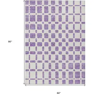 Photo of Purple And Ivory Geometric Washable Indoor Outdoor Area Rug