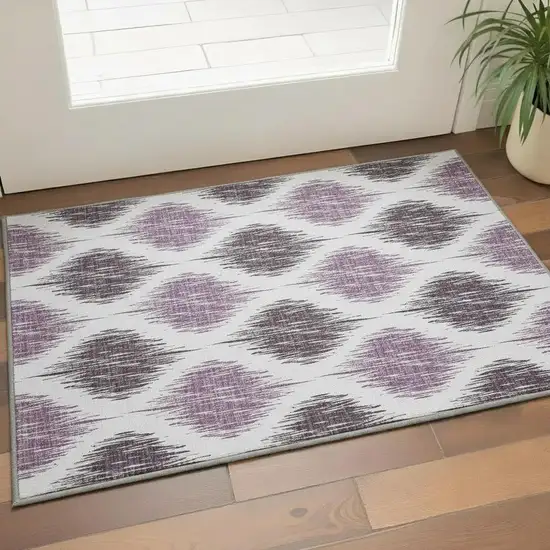Purple And Ivory Ikat Washable Area Rug With UV Protection Photo 2