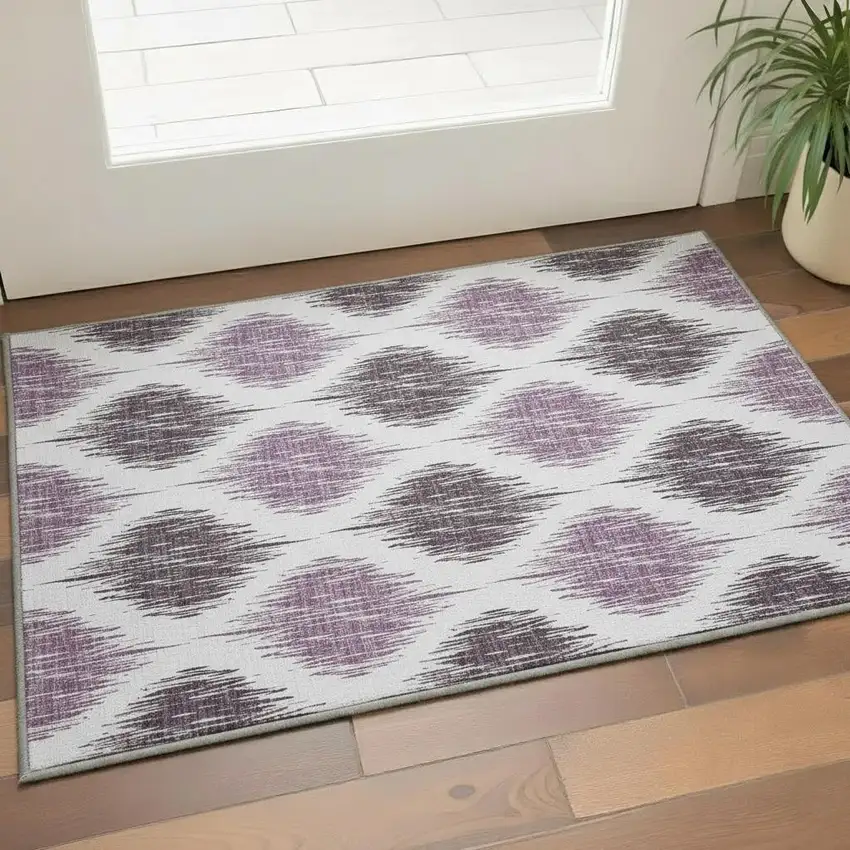 Purple And Ivory Ikat Washable Area Rug With UV Protection Photo 2