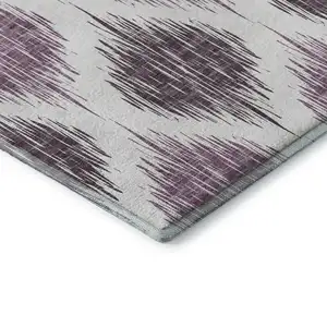 Photo of Purple And Ivory Ikat Washable Area Rug With UV Protection