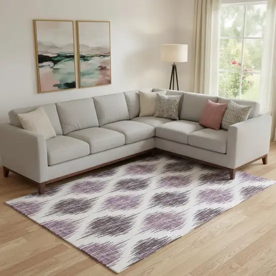 Purple And Ivory Ikat Washable Area Rug With UV Protection Photo 1