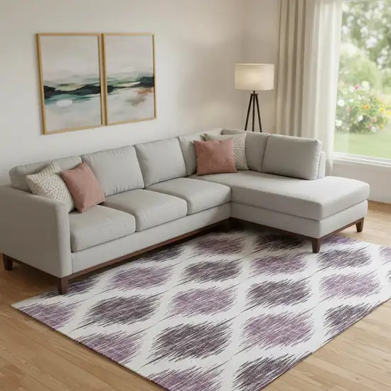 Purple And Ivory Ikat Washable Area Rug With UV Protection Photo 1
