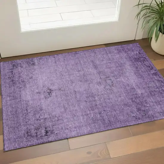 Purple And Ivory Oriental Washable Area Rug With UV Protection Photo 1