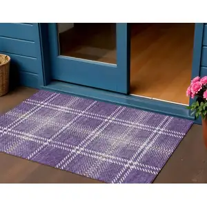 Photo of Purple Gold And Ivory Plaid Washable Indoor Outdoor Area Rug