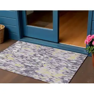 Photo of Purple Gold And Ivory Striped Washable Indoor Outdoor Area Rug