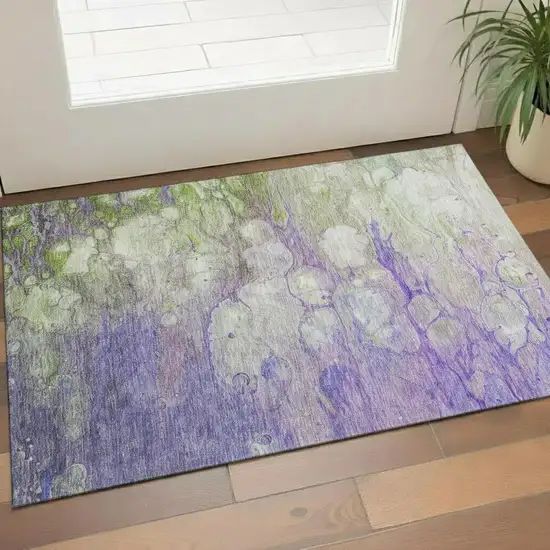 Purple Green And Ivory Abstract Washable Area Rug With UV Protection Photo 1