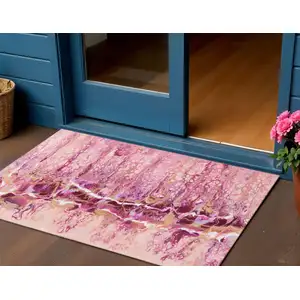 Photo of Raspberry Ivory And Gold Abstract Washable Indoor Outdoor Area Rug