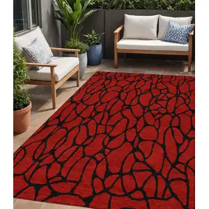 Photo of Red And Black Geometric Washable Indoor Outdoor Area Rug