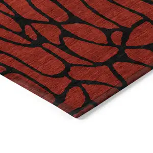 Photo of Red And Black Geometric Washable Indoor Outdoor Area Rug