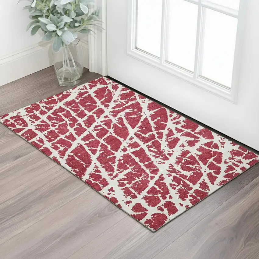 Red And Ivory Abstract Washable Area Rug With UV Protection Photo 1