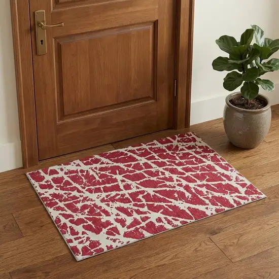 Red And Ivory Abstract Washable Area Rug With UV Protection Photo 1
