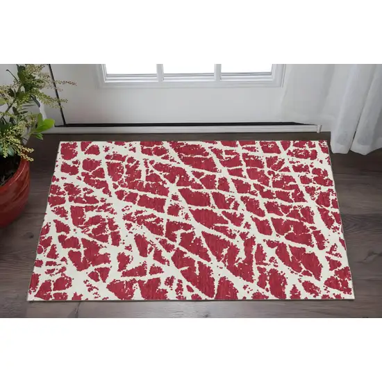 Red And Ivory Abstract Washable Area Rug With UV Protection Photo 2