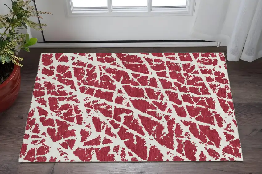 Red And Ivory Abstract Washable Area Rug With UV Protection Photo 2