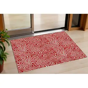 Photo of Red And Ivory Abstract Washable Indoor Outdoor Area Rug
