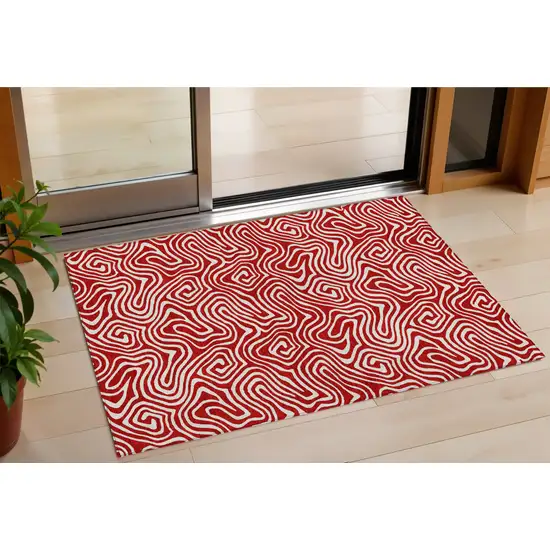 Red And Ivory Abstract Washable Indoor Outdoor Area Rug Photo 1