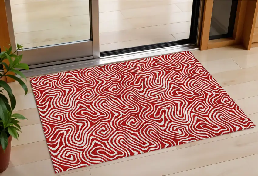 Red And Ivory Abstract Washable Indoor Outdoor Area Rug Photo 1