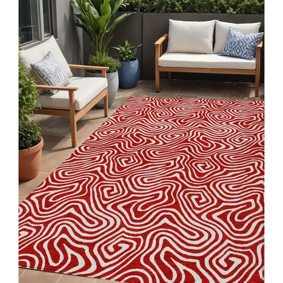 Red And Ivory Abstract Washable Indoor Outdoor Area Rug Photo 1