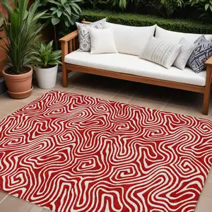 Photo of Red And Ivory Abstract Washable Indoor Outdoor Area Rug