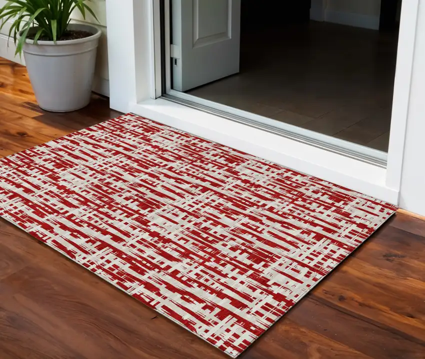 Red And Ivory Abstract Washable Indoor Outdoor Area Rug Photo 1