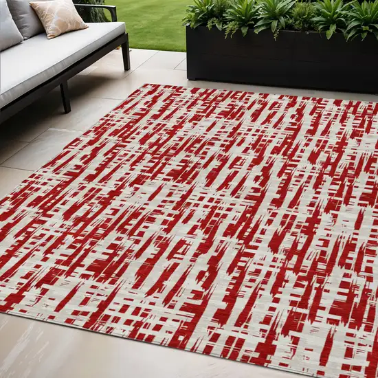 Red And Ivory Abstract Washable Indoor Outdoor Area Rug Photo 1